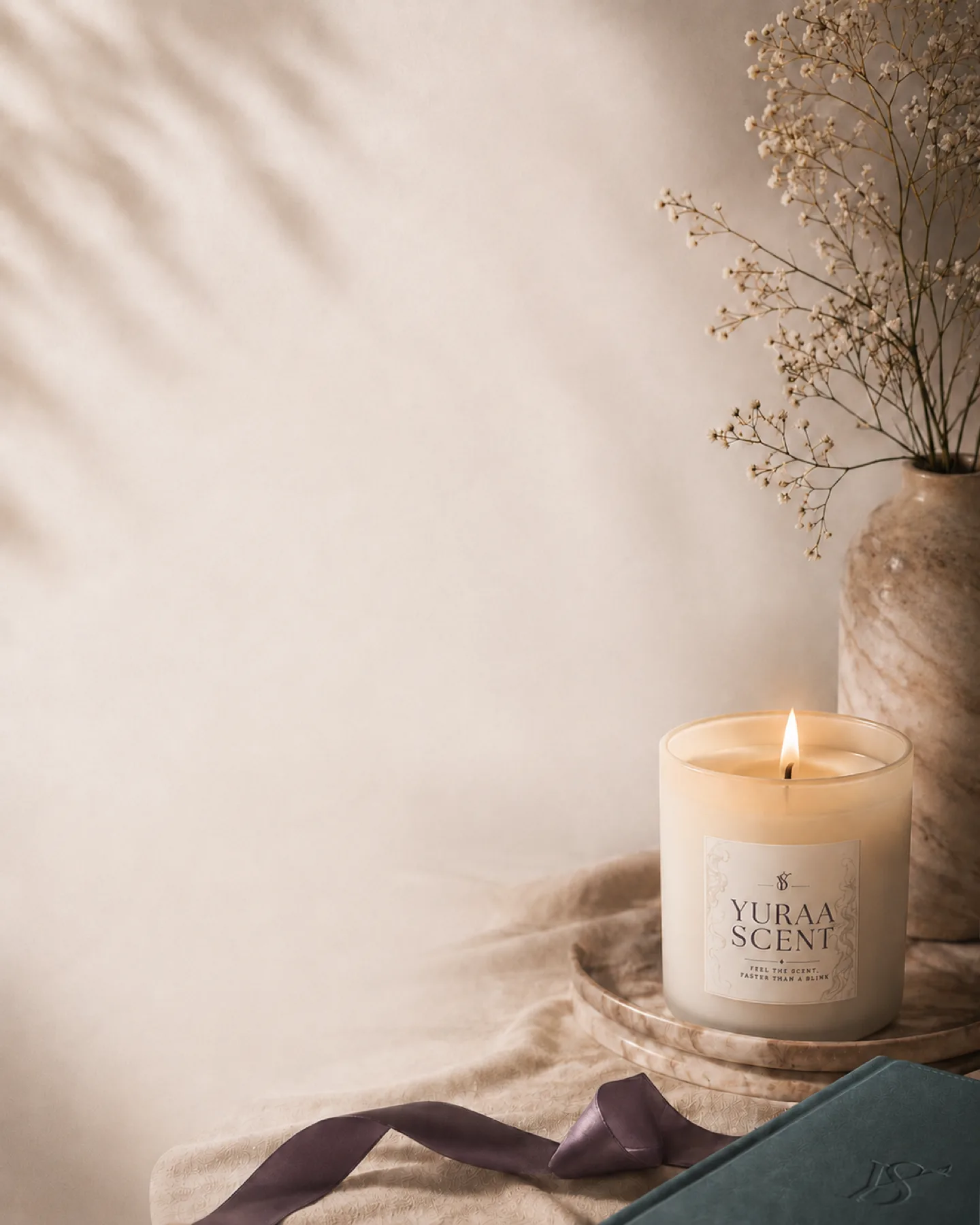 Yuraa Scent candle styled as a warm memory moment